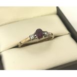 A vintage 9ct gold ruby and diamond dress ring.