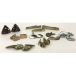 A small collection of vintage cufflinks and tie clips.