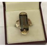 A vintage 9ct gold contemporary design smoked quartz set dress ring.