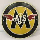 A circular shaped, painted cast metal AJS Matchless Motorcycles wall plaque.