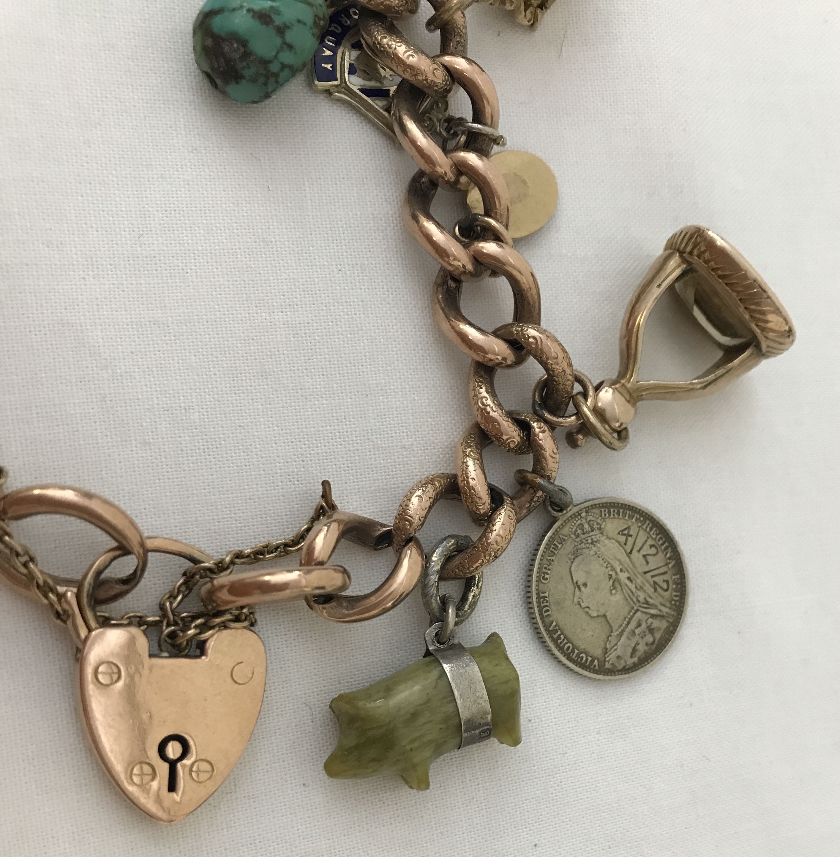 A vintage 9ct chunky rose gold charm bracelet with padlock and safety chain. - Image 5 of 5