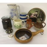 A box of assorted china and stoneware ceramic items to include jugs.