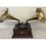 A reproduction wooden cased twin horn gramophone marked "Victrola".