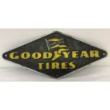 A painted cast metal, diamond shaped Goodyear wall plaque, with fixing holes.