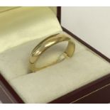 An 18ct gold wedding band. Fully hallmarked to inside of band. Ring size V.