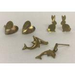 3 pairs of 9ct gold earrings; rabbit shaped studs, tri colour heart studs and dolphin drops.
