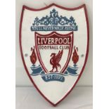 A painted cast metal wall hanging Liverpool FC shield shaped plaque.