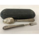 A Victorian silver spoon and matching fork in original case.