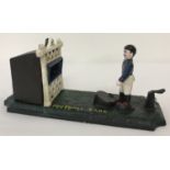 A painted cast metal Football bank money box.