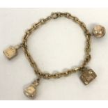 A vintage rolled gold charm bracelet with 4 charms.