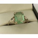 A 9ct gold dress ring, set with a octagon cut light green stone.