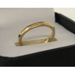 A vintage hexagon shaped 22ct gold wedding band.