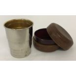 A vintage white metal, gilt lined collapsable travelling cup in original leather case.