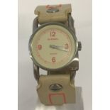 A ladies modern wristwatch by Diesel with cream leather strap with neon orange stitching.