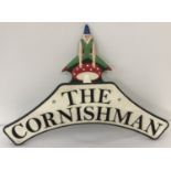 A painted cast metal The Cornishman sign with pixie motif.