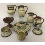 A quantity of assorted Torquay ware pottery items to include motto ware.