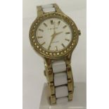 A ladies modern gold tone stainless steel and ceramic strap wristwatch by DKNY.