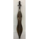 A vintage dark wood cased ethnic style stringed lap instrument.