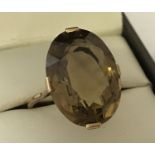 A vintage 9ct gold dress ring set with large smoked quartz.