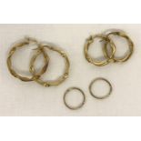 3 pairs of 9ct gold hoop earrings in varying sizes.