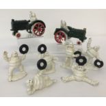 8 small cast metal Michelin men figurines, 2 in tractors.