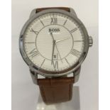 A men's modern wristwatch by Hugo Boss on a brown leather strap.
