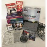 A boxed PlayStation 1 Dual Shock console and accessories bundle, in excellent condition.