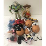 A collection of Toy Story character toys; Buzz Lightyear and Singing Woody