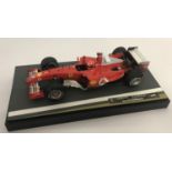 A limited edition Michael Schumacher 2004 Sakhir/Bahrain F1 Ferrari racing car by Hot Wheels.