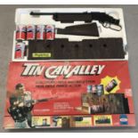 A vintage boxed Ideal games 'Tin Can Alley' electronic rifle and target game.
