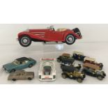 A collection of diecast and plastic cars.