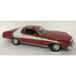 An unboxed 1:18 scale diecast model of Starsky And Hutch 1976 Ford Gran Torino by ERTL.