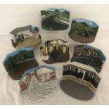 8 assorted heavy resin diorama displays for models cars; 2 marked Vanguards.