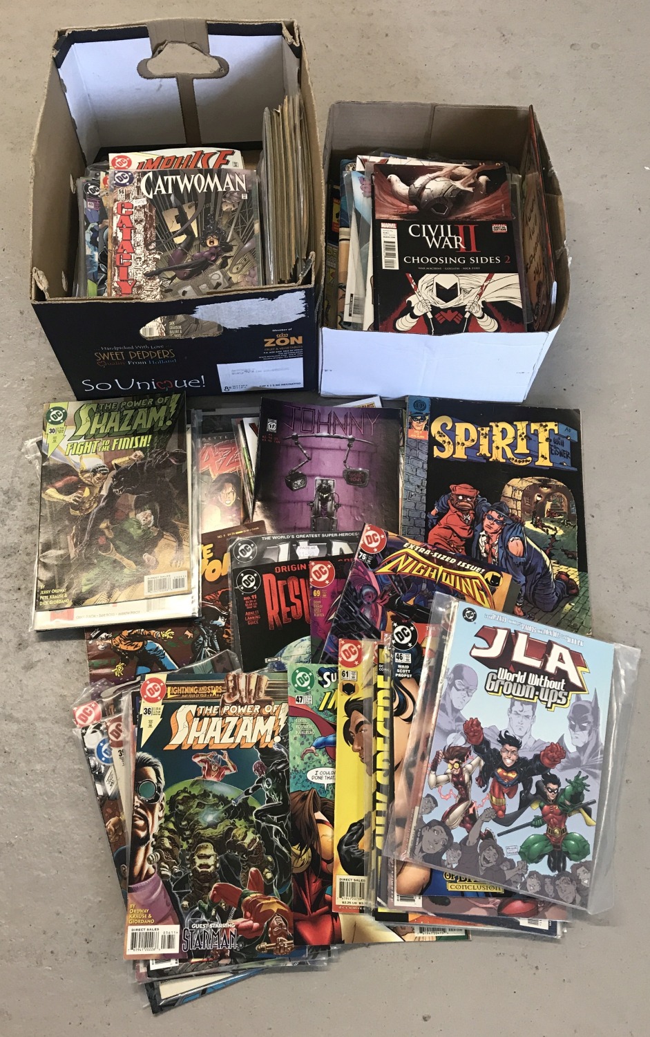 2 boxes containing 155 comics to include DC comics.