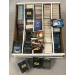 A quantity of assorted trading cards and boxed card games.