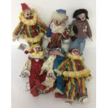 6 vintage clown dolls with ceramic heads, hands and feet.