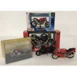 A collection of boxed and unboxed diecast model motorcycles.