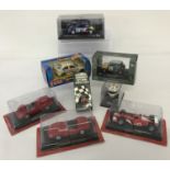 A collection of diecast model rally, racing & sports cars together with 2 racing helmet key chains