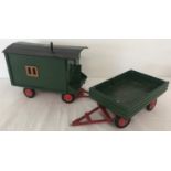 2 painted wooden trailers; one in the style of a shepherd's hut.