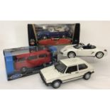 A collection of 4 boxed and unboxed diecast collectors vehicles.