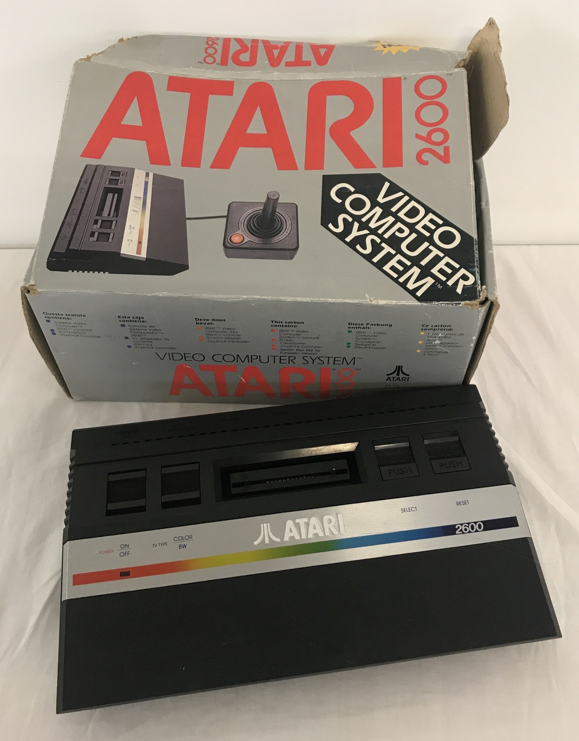 A boxed 1980's Atari 2600 console, no power lead or joy stick.