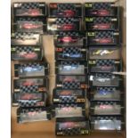 A box containing 26 assorted Onyx F1 boxed collectors racing car models from the 1991 & 92 seasons.