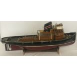 A vintage scratch built model boat with 6V battery. Complete with stand, in need of restoration.