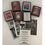 6 1980's Atari 2600 game cartridges; 5 of them with instructions manuals.