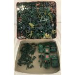 A large quantity of 54mm plastic toy soldiers, mostly marked "Made in Hong Kong".