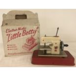 A vintage child's Electro Matic "Little Betty" sewing machine complete with original box.