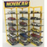 A 1990's plastic Novacar display stand complete with 18 Novacar 100 series diecast vehicles.