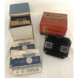 A boxed Bakelite Sawyers 3D View-master together with a box of viewing reels in original sleeves.