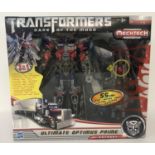 A new boxed (unopened) 2011 Transformers "Dark Side Of The Moon" Ultimate Optimus Prime by Hasbro.