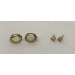 2 pairs of 9ct gold stud style earrings. A pair of oval cut opal stones in oval gold mounts.